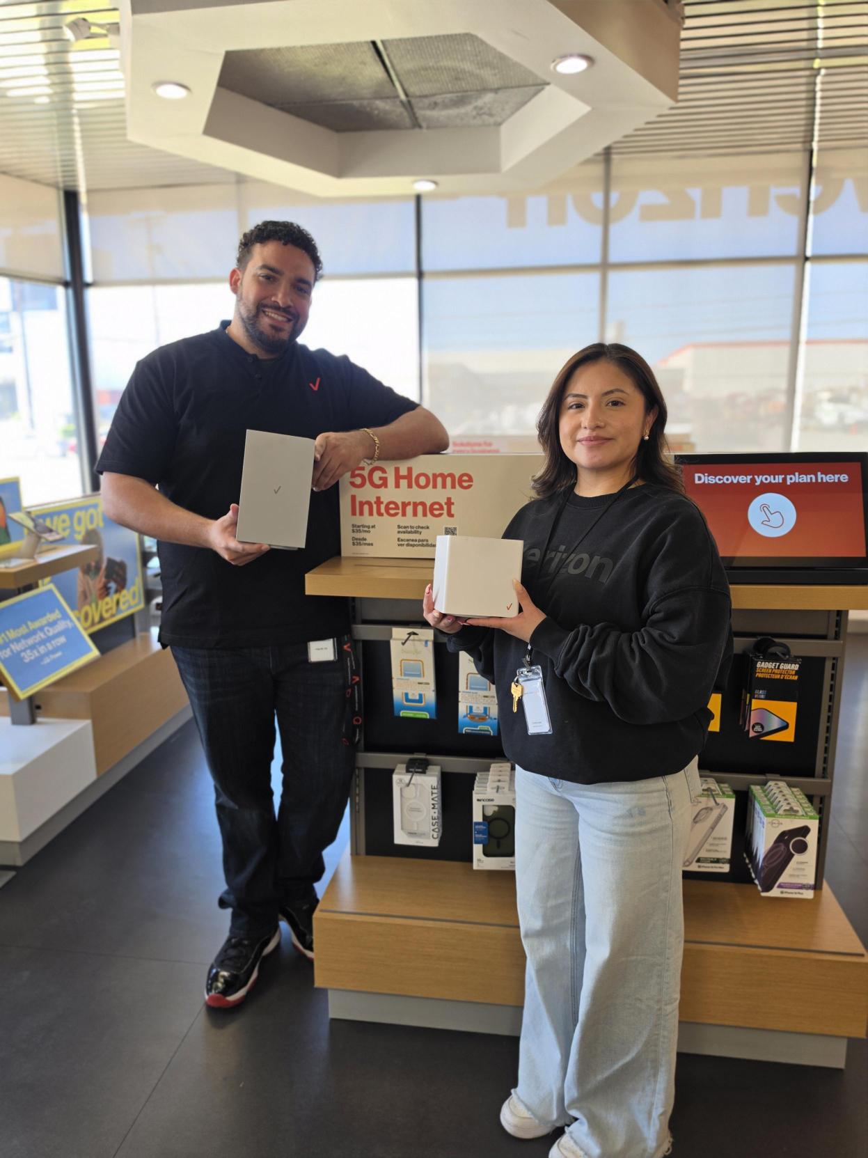 Wireless Plus team members in store